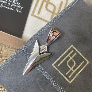 Silver and rose gold arrowhead pendant